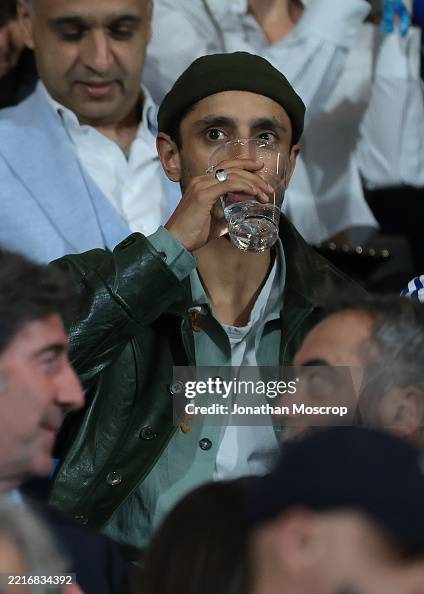 Rapper Joe Riz Brtish Actor and Rapper Riz Ahmed drinks water from a plastic cup as ...