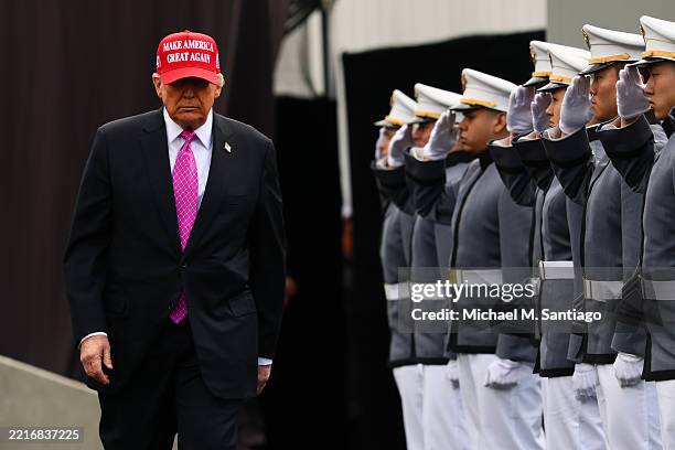 President Donald Trump walks the field prior to addressing graduates of the United States Military Academy at West Point in Michie Stadium on May 24,...