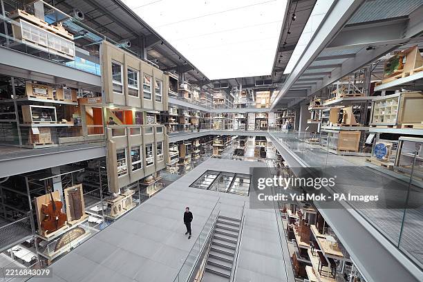 Exhibits on display in the three-storey central Collections Hall, including paintings, drum kits, motorbikes and sculptures, at the V&A East...
