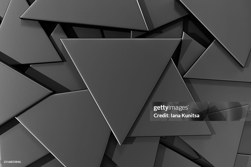 Dark geometric background with overlapping black, gray triangles, 3D abstract composition, modern minimal design, matte texture with subtle highlights, futuristic tech style.