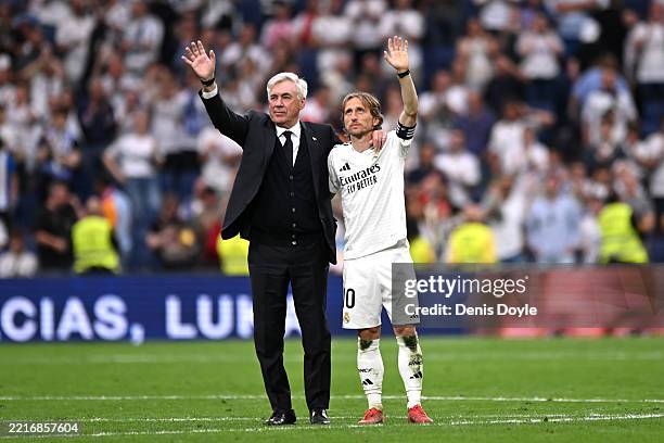 Carlo Ancelotti, Head Coach of Real Madrid, acknowledges the fans with Luka Modric following his final appearance for Real Madrid after the LaLiga...