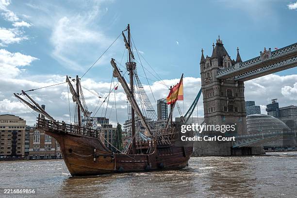 Replica of the Nao Santa Maria sails through Tower Bridge and into St Katharine Docks Marina on May 28, 2025 in London, England. The 200 ton...