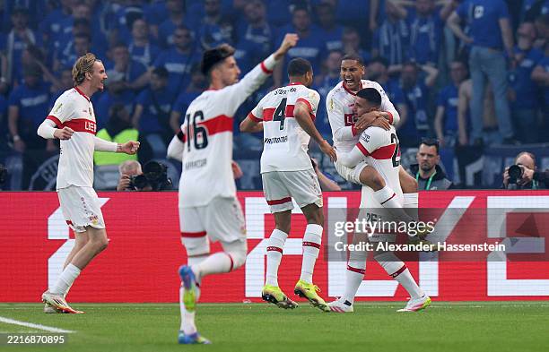 Enzo Millot of VfB Stuttgart celebrates scoring his team's second goal with teammate Deniz Undav and Josha Vagnoman during the DFB Cup Final 2025...