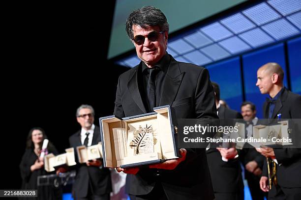 Jafar Panahi accepts the Palme d'Or for "Un simple accident" onstage during the closing ceremony at the 78th annual Cannes Film Festival at Palais...