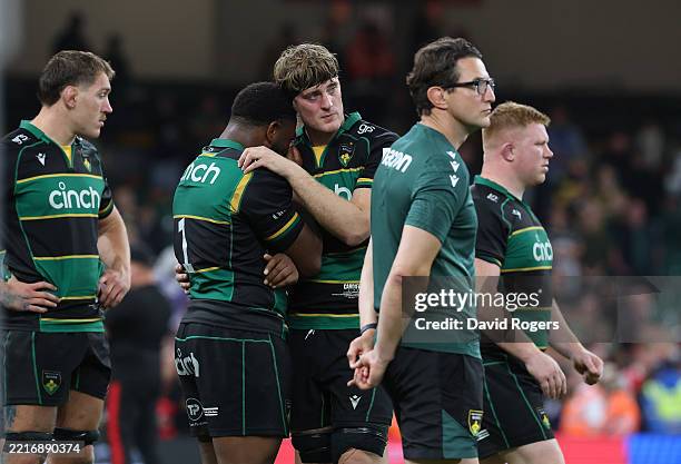 Emmanuel Iyogun of Northampton Saints is consoled by team mate Alex Coles after their defeat during the Investec Champions Cup final match between...