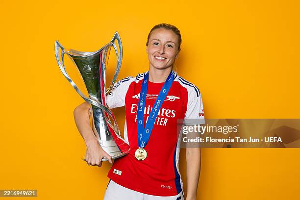LISBON, PORTUGAL Leah Williamson of Arsenal poses for a portrait with the UEFA Women's Champions League Trophy, after Arsenal defeat FC Barcelona in...