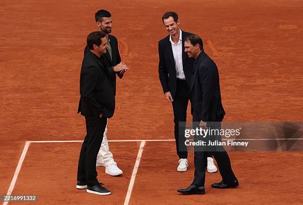 Rafael Nadal smiles as he greets Roger Federer, Novak Djokovic and Andy Murray on Court Philippe-Chatrier during a ceremony held in his honour on Day...