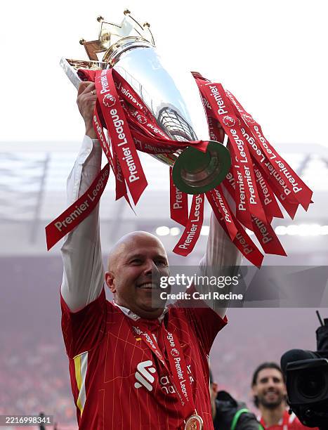 Arne Slot, Manger of Liverpool, celebrates with the Premier League trophy trophy, as Liverpool are crowned the Champions of the Premier League for...