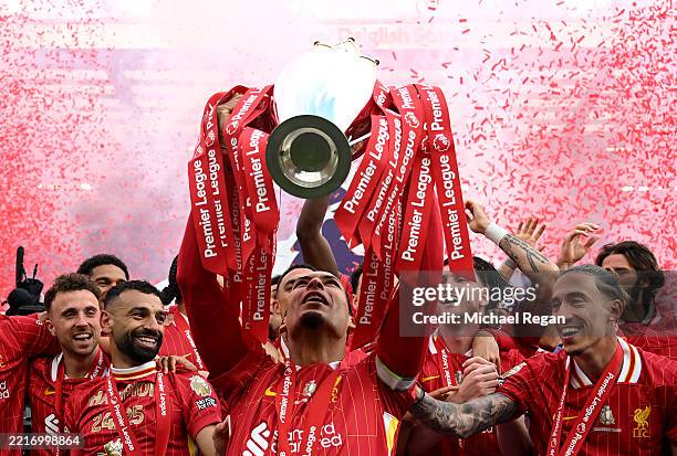 Virgil van Dijk of Liverpool, lifts the Premier League trophy, as Liverpool are crowned the Champions of the Premier League for the 2024/25 Season,...