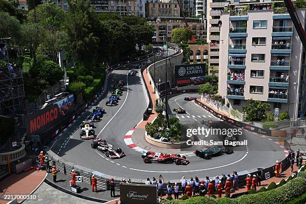 Max Verstappen of the Netherlands driving the Oracle Red Bull Racing RB21 leads Isack Hadjar of France driving the Visa Cash App Racing Bulls VCARB...