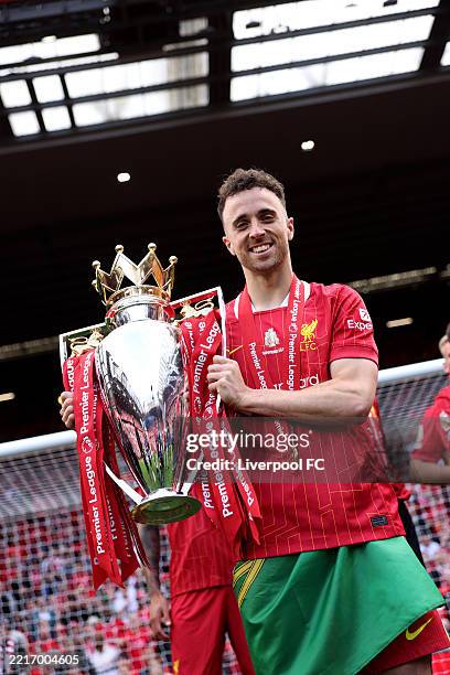 Diogo Jota of Liverpool poses for a photograph with the Premier League trophy, as Liverpool are crowned the Champions of the Premier League,...