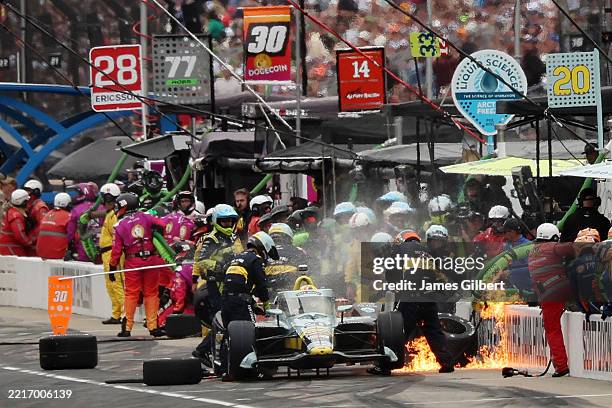 Alexander Rossi, driver of the ECR Java House Chevrolet, leaves his car as it catches on fire on pit road during the NTT IndyCar Series109th Running...