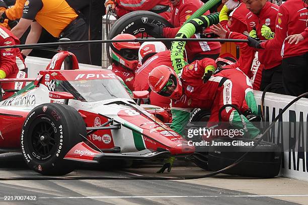 Robert Shwartzman, driver of the PREMA Racing Chevrolet, runs into his crew as he pits during the NTT IndyCar Series109th Running Of The Indianapolis...