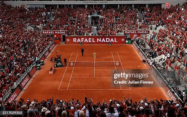 Rafael Nadal waves to the crowd on Court Philippe-Chatrier at the end of a ceremony held in his honour on Day One of the 2025 French Open at Roland...