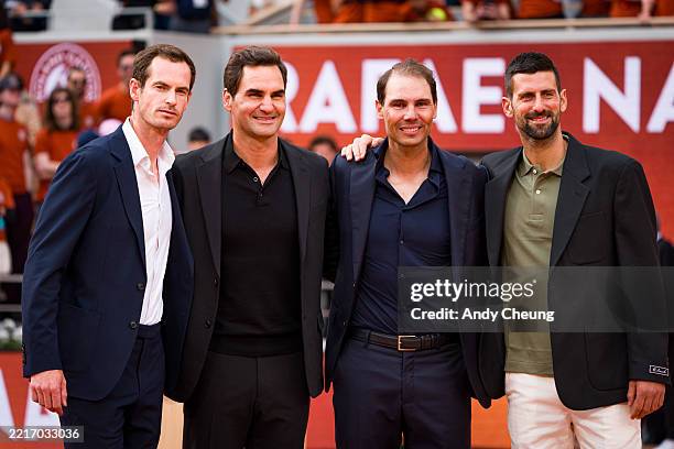 Andy Murray, Roger Federer, Rafael Nadal and Novak Djokovic pose for a photo on Court Philippe-Chatrier during a ceremony held in Rafael Nadal's...