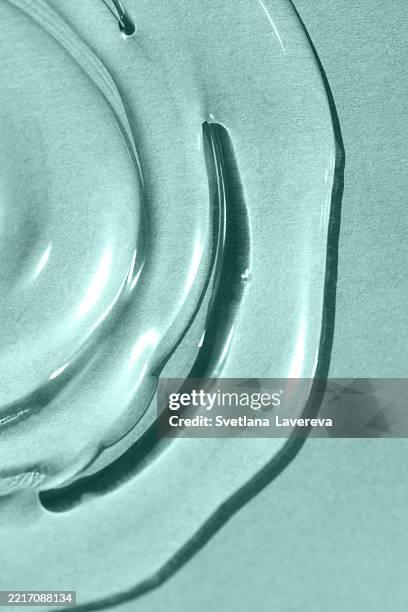 abstract texture. liquid gel cosmetics. pink background. - parte del cuerpo animal fotografías e imágenes de stock