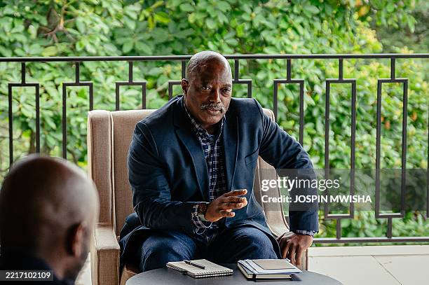 Former President of the Democratic Republic of Congo Joseph Kabila gestures during a meeting with traditional leaders at one of his residences in...