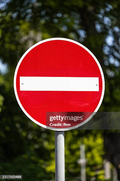 no entry - road sign with trees in background - exclusion stock pictures, royalty-free photos & images