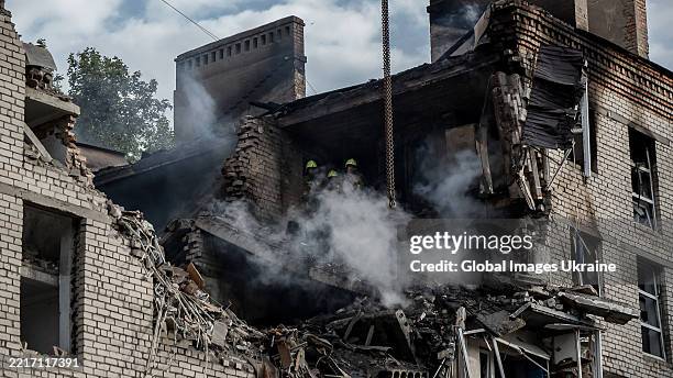 Rescuers work at the site of a Russian drone strike on a residential building on May 25, 2025 in Mykolaiv, Ukraine. The Russian army attacked the...
