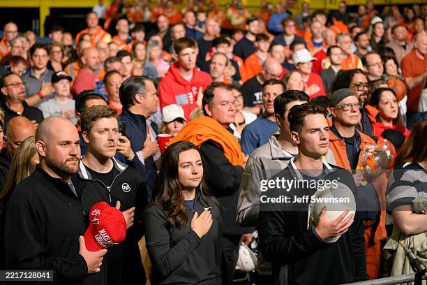 Supporters recite The Pledge of Allegiance as they await President Donald Trump's arrival at the US Steel-Irvin Works on May 30, 2025 in West...