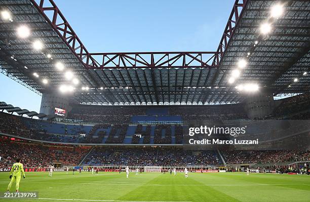 General view inside the stadium as fans of AC Milan protest by sitting in an arrangement to spell out "go home" in the stands during the Serie A...
