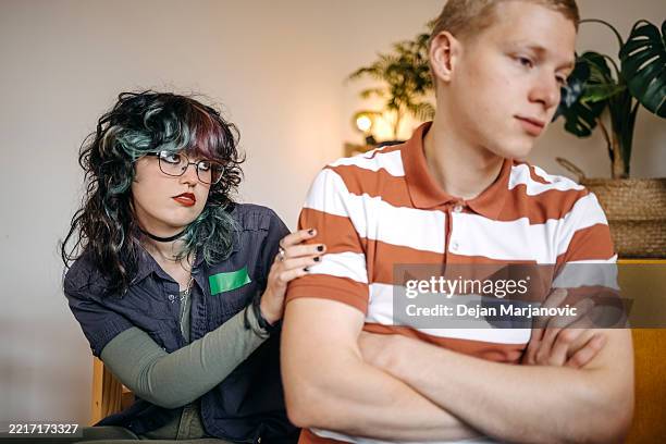 young couple having relationship difficulties and breaking up at home feeling sadness - resolve conflict stock pictures, royalty-free photos & images
