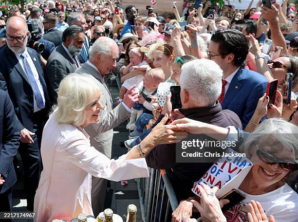 Queen Camilla and King Charles III meet members of the public at a community event in Lansdowne Park during an official visit to Canada on May 26,...