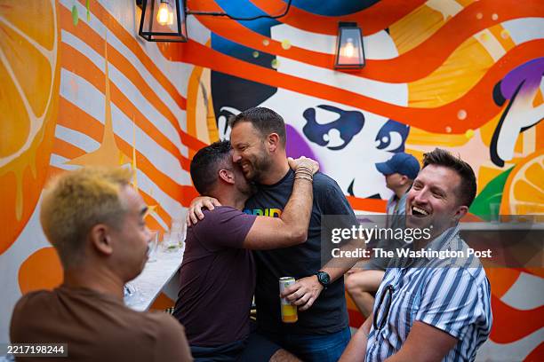 Owner Stephen Rutgers greets friends on the rooftop deck of Crush on May 29, 2025 in Washington. The District is set to host World Pride events from...