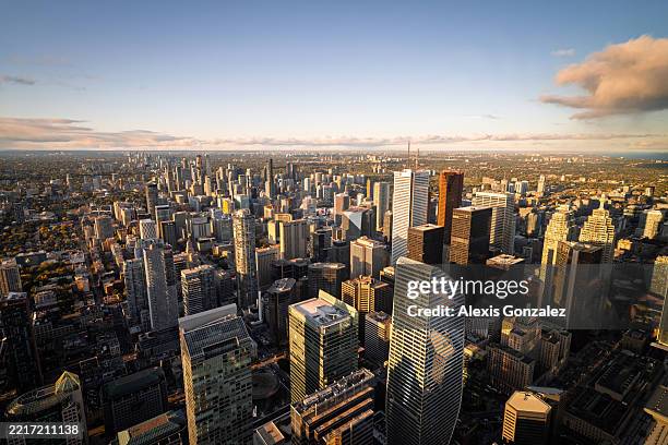 aerial views of downtown toronto and waterfront at sunset - skyscraper stock pictures, royalty-free photos & images