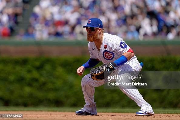 Justin Turner of the Chicago Cubs plays first base in a game against