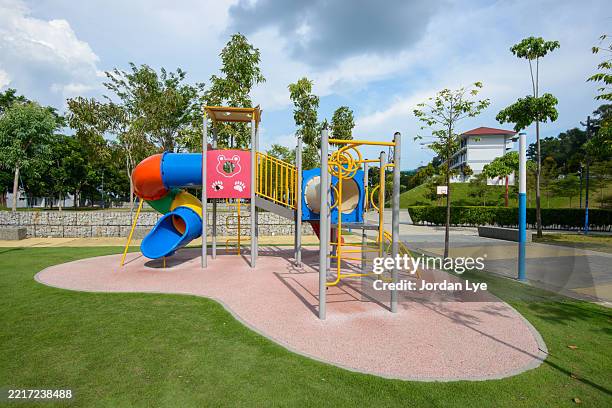 plastic structure of the play area in a park - spielgerät stock-fotos und bilder