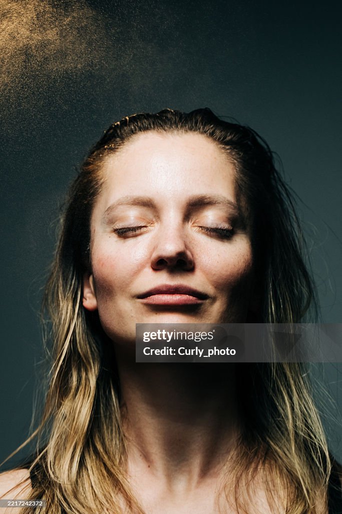 Woman haircare concept. Woman spraying hairspray.