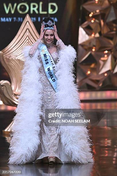 Thailand's Opal Suchata Chuangsri celebrates after winning the 72th Miss World 2025 pageant at the HITEX Exhibition Centre in Hyderabad on May 31,...
