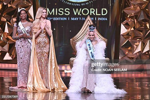 Thailand's Opal Suchata Chuangsri celebrates next to Czech model and Miss World 2024 Krystyna Pyszkova after winning the 72th Miss World 2025 pageant...