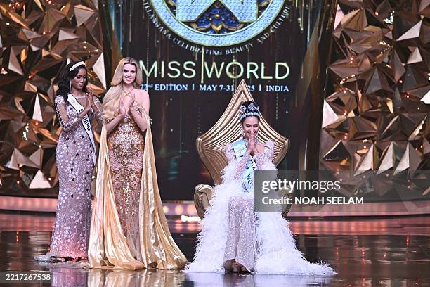 Thailand's Opal Suchata Chuangsri celebrates next to Czech model and Miss World 2024 Krystyna Pyszkova after winning the 72th Miss World 2025 pageant...