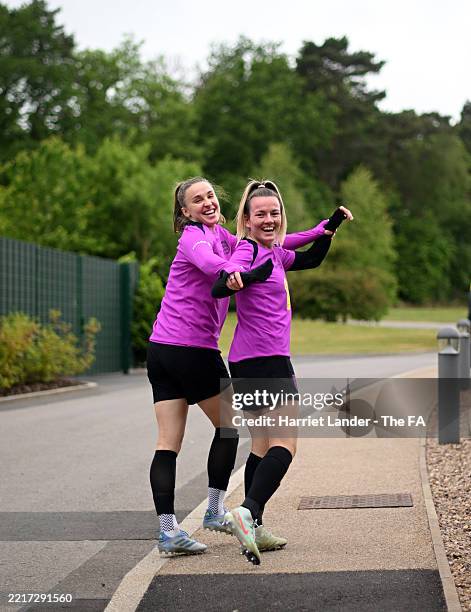 Lauren Hemp and Niamh Charles of England make their way out prior to a training session at St Georges Park on May 26, 2025 in Burton-upon-Trent,...