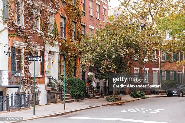 residential street in greenwich village in autumn, new york city, usa - west village stock pictures, royalty-free photos & images