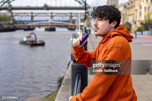 disposable vape use - stop smoking stock pictures, royalty-free photos & images