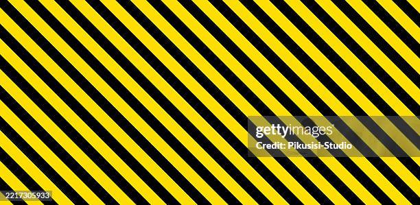 black and yellow diagonal line striped pattern. warning striped rectangular background - police background stock illustrations