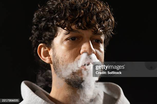 silent clouds, loud consequences - electronic-cigarette stock pictures, royalty-free photos & images