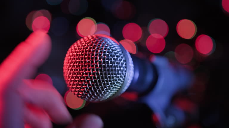 https://media.gettyimages.com/id/2217309644/video/soloist-takes-microphone-with-hand-checking-sound-by-tapping-finger-before-start-of.jpg?b=1&s=640x640&k=20&c=BzC5b4Hhp5MyjHQwV9NX78-HYqa0fOAagjtW2ynDqq8=