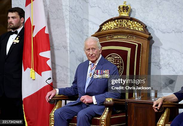King Charles III sits on the throne in the Senate Chamber for the State Opening of Parliament during an official visit to Canada on May 27, 2025 in...