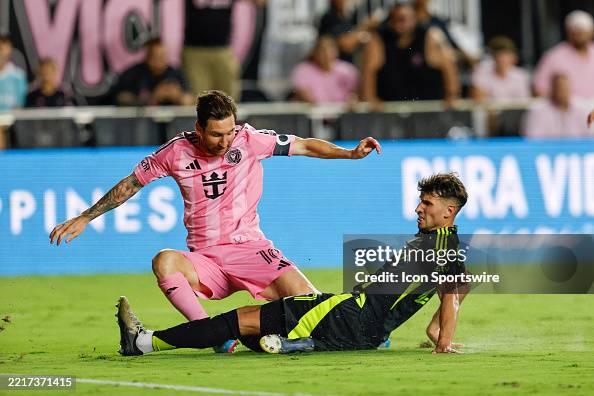 Samuel Basabe Lionel Messi of Inter Miami CF shoots the ball as Stanislav Lapkes of ...