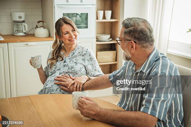 sweet mature couple expecting baby - human fertility stock pictures, royalty-free photos & images
