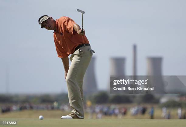 Ben Curtis of the USA putts on the tenth green during the final round of the Open Championship at the Royal St. George's course on July 20, 2003 in...