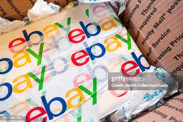 Logo for Ebay on packaging inside a USPS Priority Mail box, Lafayette, California, May 22, 2025.