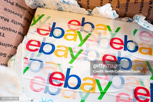 Logo for Ebay on packaging inside a USPS Priority Mail box, Lafayette, California, May 22, 2025.