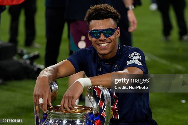 Desire Doue left winger of PSG and France celebrates with the trophy after winning the UEFA Champions League Final 2025 between Paris Saint-Germain...