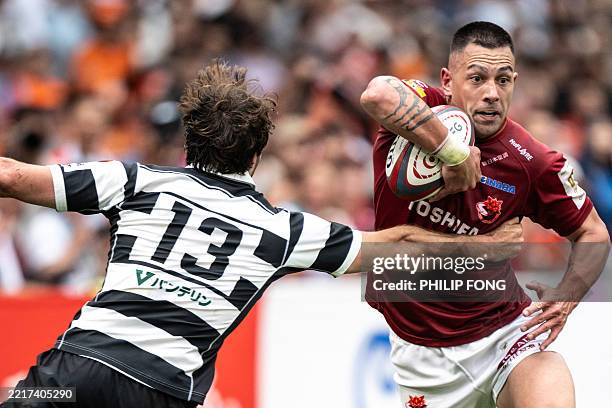 Toshiba Brave Lupus Tokyo's Rob Thompson is challenged by Kubota Spears Funabashi Tokyo Bay's Rikus Pretorius during the Rugby League One 2024-25...