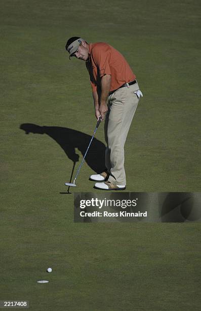 Ben Curtis of the USA putts on the 18th green to finish one under during the final round of the Open Championship at the Royal St. George's course on...